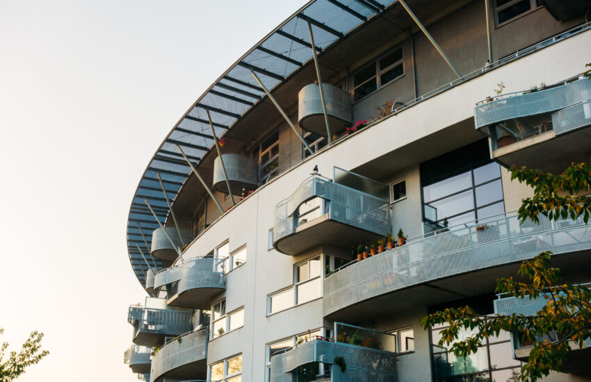 futuristic-facade-of-apartment-complex-with-curved-2025-10-06-17-47-20-utc
